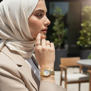 Woman wearing Michael Kors Lexington Mini gold watch reflecting a sophisticated and elegant lifestyle