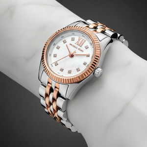 Close-up of Michael Kors MK4817 white dial with crystal indices and rose gold fluted bezel