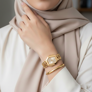 Modest woman wearing Michael Kors MK4878 gold hexagonal chain watch on hairless wrist
