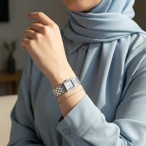 Modest woman wearing Michael Kors MK4933 silver square watch on hairless wrist