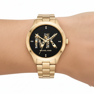 Extreme close-up of Michael Kors MK6682 showing studs and stars on MK logo
