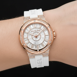 Extreme close-up of Michael Kors MK7248 showing baguette crystal dial and rose gold bezel