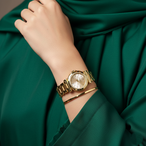 Modest woman wearing Michael Kors MK7516 gold rectangular watch on hairless wrist