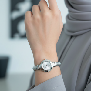 Elegant style: Hijabi woman wearing Michael Kors MK7529 silver bangle watch on hairless wrist