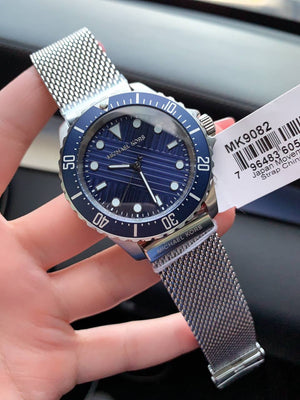 Michael Kors MK9082 Everest on male wrist showing clean silver and blue style