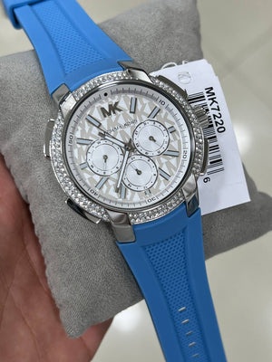 Close-up of the Michael Kors branding and silver-tone indices on the white Sidney MK7220 dial