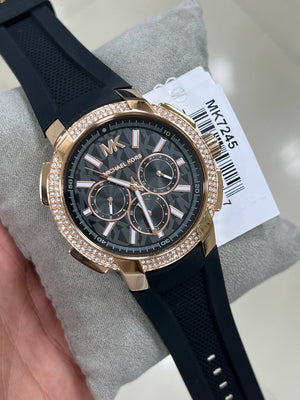 Extreme close-up of the pavé crystals on the rose gold bezel of the Michael Kors MK7245
