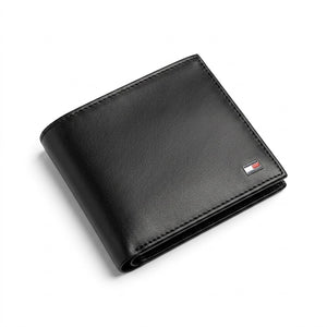 Professional angled studio photograph of the sleek Tommy Hilfiger mirror original smooth black leather bifold wallet