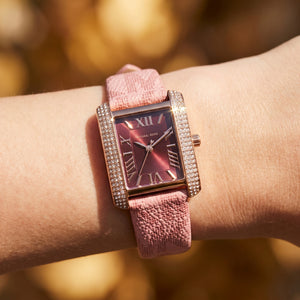 Close up shot of MK2966 highlighting the burgundy dial and rose gold roman numerals with crystal accents