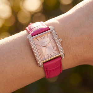 Close up shot of MK2984 highlighting the rose gold sunray dial and crystal accents