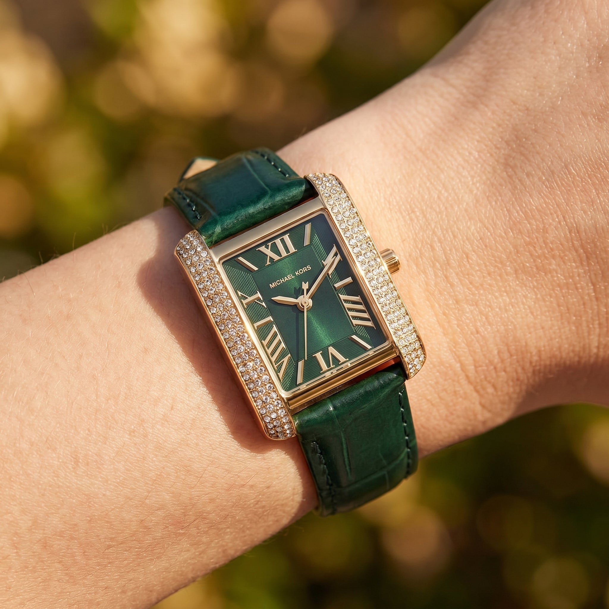 Close up shot of MK4697 highlighting the deep green dial and rose gold roman numerals with crystal accents