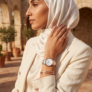 Elegant woman wearing Michael Kors Runway MK6671 with rose gold-tone case and iridescent mother of pearl dial luxury style watch