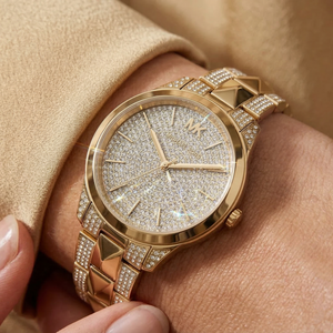 Close up of Michael Kors Runway Mercer MK6715 on wrist showing full pavé crystal dial and gold metal Mercer link bracelet