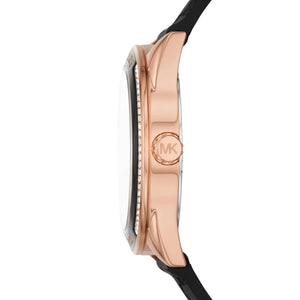 Detailed view of rose gold-tone crown on Michael Kors Jessa MK7266 women's quartz battery watch with black dial and rubber strap