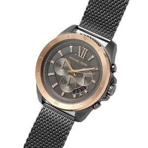 Right angled view of Michael Kors Brecken MK8868 men's quartz battery watch highlighting rose gold bezel and grey dial details