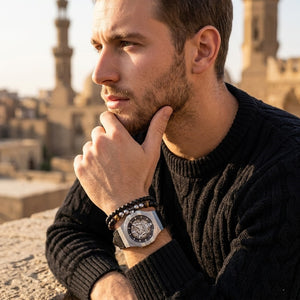 Elegant man wearing Maserati Potenza R8821108031 men's automatic watch with silver-tone case and luxury skeleton dial