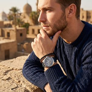 Elegant man wearing Maserati Epoca R8821118002 automatic watch with silver case and luxury skeleton dial