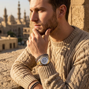 Elegant man wearing Maserati Traguardo R8823112003 automatic watch with two-tone case and luxury open heart dial