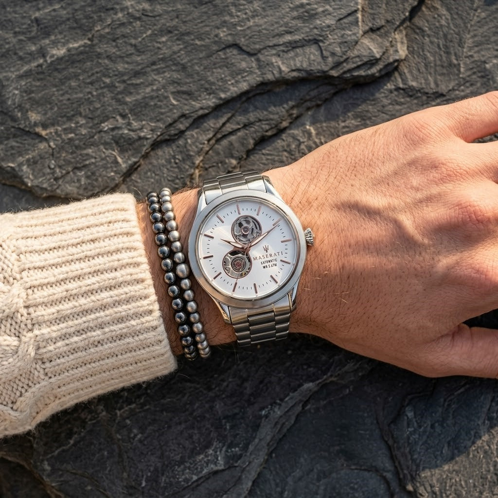 Close up of Maserati Tradizione R8823125001 automatic watch on wrist showing white open heart dial and rose gold-tone markers