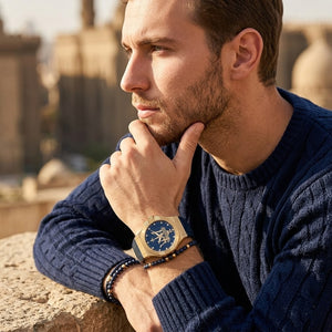 Elegant man wearing Maserati Potenza R8851108035 men's quartz battery watch with gold case and luxury blue dial