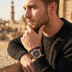 Elegant man wearing Maserati Circuito R8851127001 men's quartz battery watch with rose gold case and luxury black dial