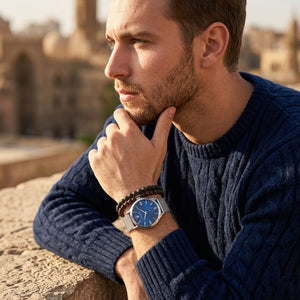Elegant man wearing Maserati Epoca R8853118006 men's quartz battery watch with silver case and luxury blue dial