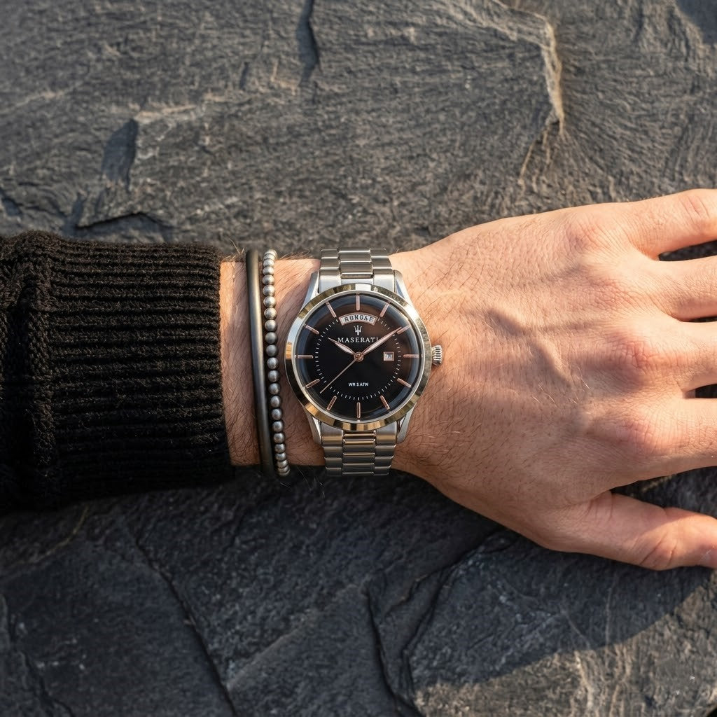 Close up of Maserati Tradizione R8853125002 men's quartz battery watch on wrist showing black dial and silver metal bracelet