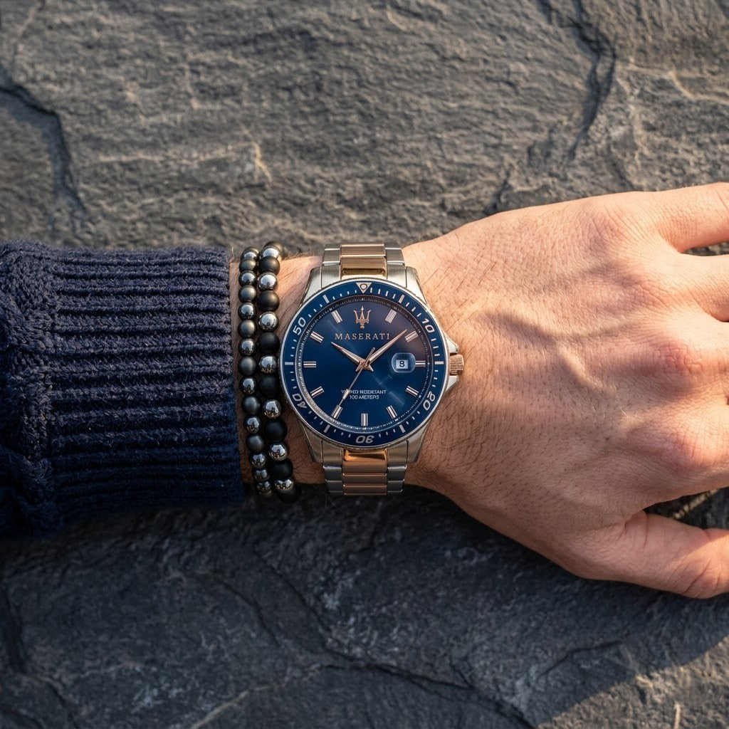 Close up of Maserati Sfida R8853140003 men's quartz battery watch on wrist showing blue sunray dial and two-tone metal bracelet