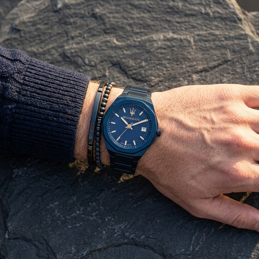Close up of Maserati Stile Blue Edition R8853141001 men's quartz battery watch on wrist showing blue waffle dial and gold-tone hands