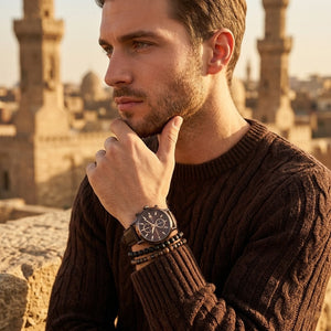 Elegant man wearing Maserati Epoca R8871618006 men's quartz battery watch with bronze case and luxury brown dial