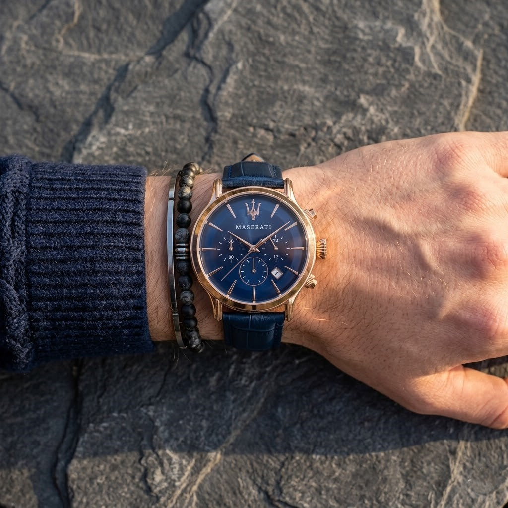 Close up of Maserati Epoca R8871618007 men's quartz battery watch on wrist showing blue sunray dial and blue leather strap