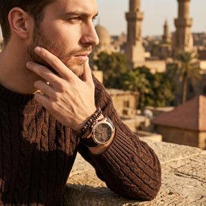 Elegant man wearing Maserati Ingegno R8871619001 men's quartz battery watch with rose gold case and multi-layered brown dial