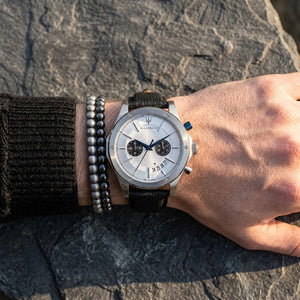 Close up of Maserati Circuito R8871627005 men's quartz battery watch on wrist showing silver textured dial and black leather strap
