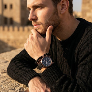 Elegant man wearing Maserati Legend R8871638001 men's quartz battery watch with bronze finish and vintage leather strap