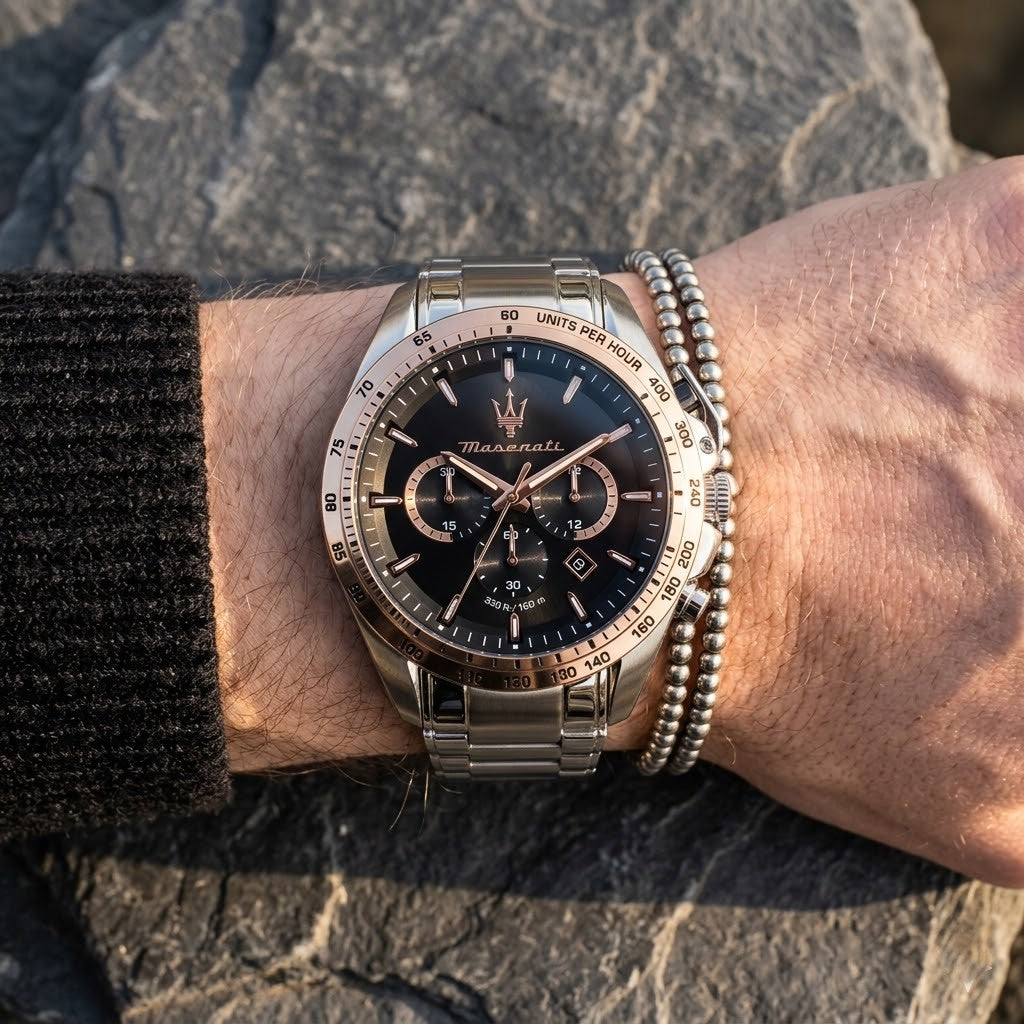 Close up of Maserati Traguardo R8873612047 men's quartz battery watch on wrist showing black chronograph dial and silver metal bracelet