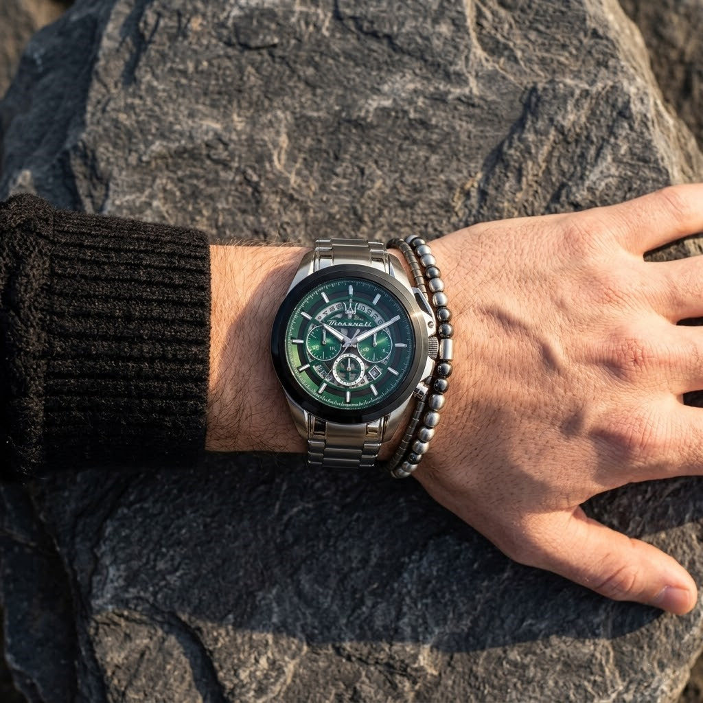 Close up of Maserati Traguardo R8873612060 men's quartz battery watch on wrist showing emerald green skeleton racing dial and silver case