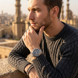 Elegant man wearing Maserati Epoca R8873618003 men's quartz battery watch with silver-tone case and luxury gray dial