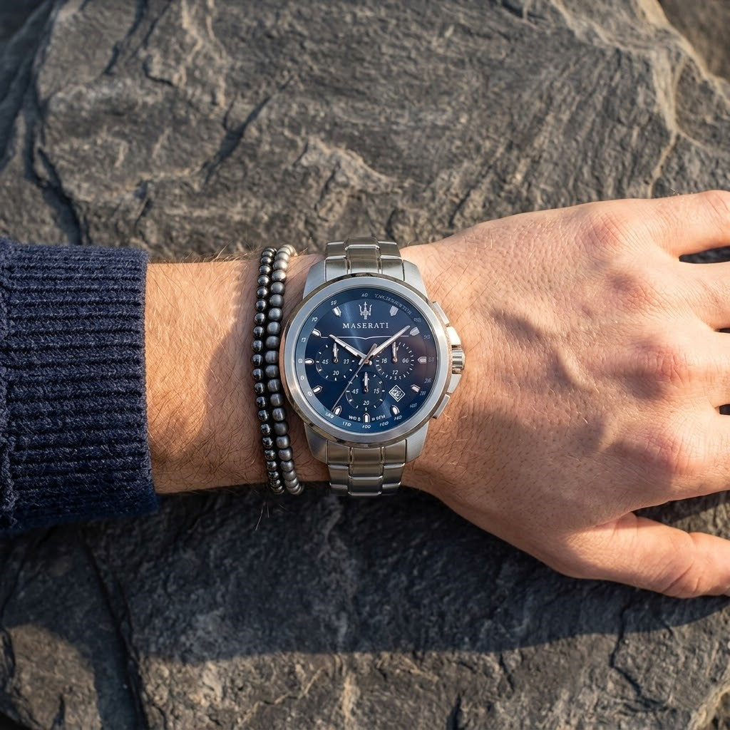 Close up of Maserati Successo R8873621002 men's quartz battery watch on wrist showing blue sunray dial and silver metal bracelet