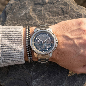 Close up of Maserati Successo R8873621006 men's quartz battery watch on wrist showing gray racing dial and silver case