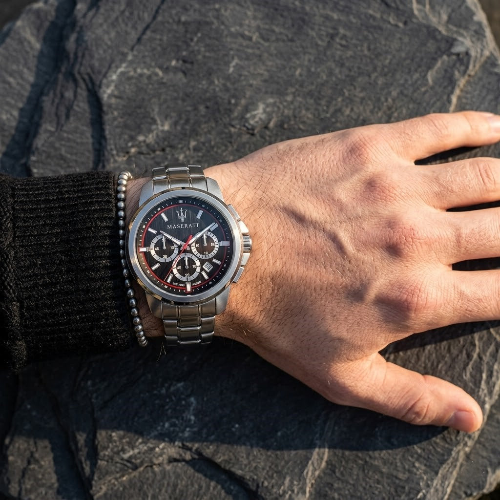 Close up of Maserati Successo R8873621009 men's quartz battery watch on wrist showing black racing dial and silver case
