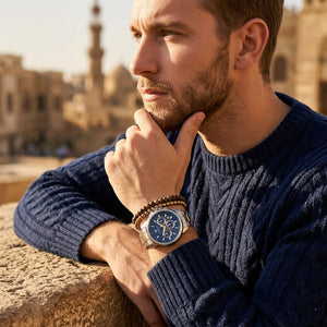 Elegant man wearing Maserati Successo R8873621016 men's quartz battery watch with two-tone case and luxury blue dial