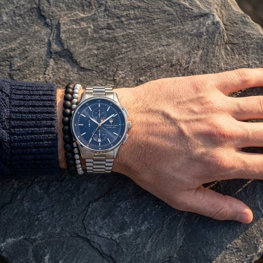 Close up of Maserati Sorpasso R8873624004 men's quartz battery watch on wrist showing blue sunray dial and silver metal bracelet