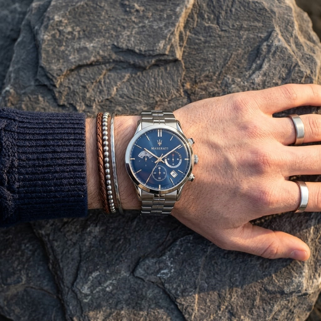 Close up of Maserati Ricordo R8873633001 men's quartz battery watch on wrist showing blue sunray dial and silver metal bracelet