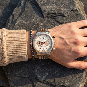 Close up of Maserati Legend R8873638002 men's quartz battery watch on wrist showing white panda dial and two-tone grain-link bracelet