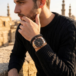 Elegant man wearing Maserati Sfida R8873640009 men's quartz battery watch with two-tone case and luxury black dial