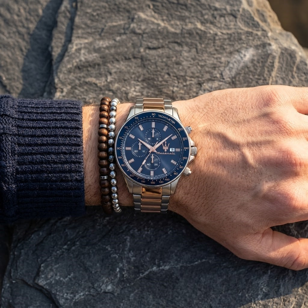 Close up of Maserati Sfida Chronograph R8873640012 men's quartz battery watch on wrist showing blue dial and luxury rose gold chronograph sub-dials