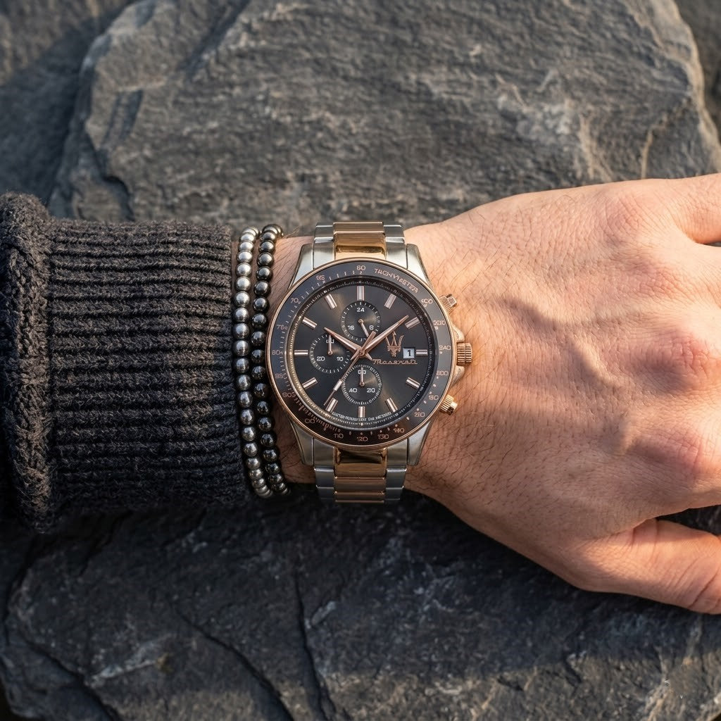 Close up of Maserati Sfida R8873640014 men's quartz battery watch on wrist showing grey chronograph dial and two-tone metal bracelet