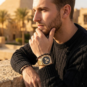 Elegant man wearing Maserati Stile Chronograph R8873642001 men's quartz battery watch with gold case and luxury racing black dial