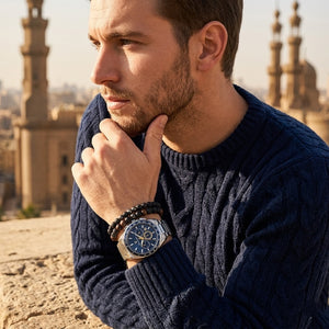 Elegant man wearing Maserati Velocita R8873652001 men's quartz battery watch with silver-tone case and luxury racing dial