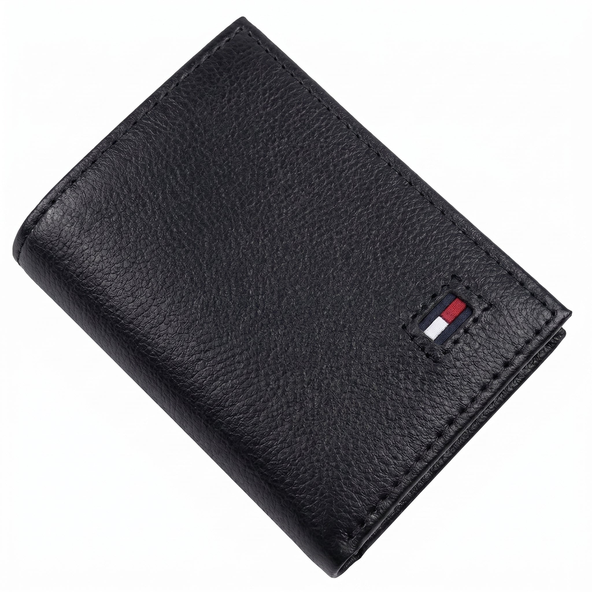 Front studio view of the Tommy Hilfiger black trifold wallet showing the premium grained leather texture and small enamel flag logo